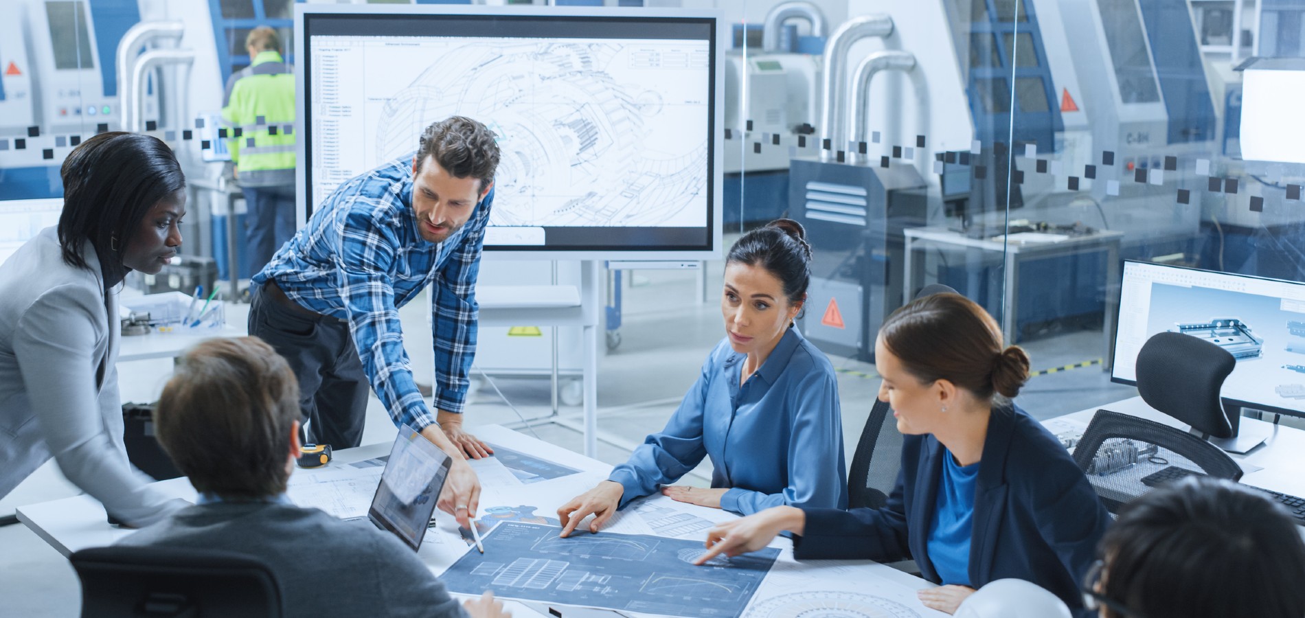 employees discussing work around a table