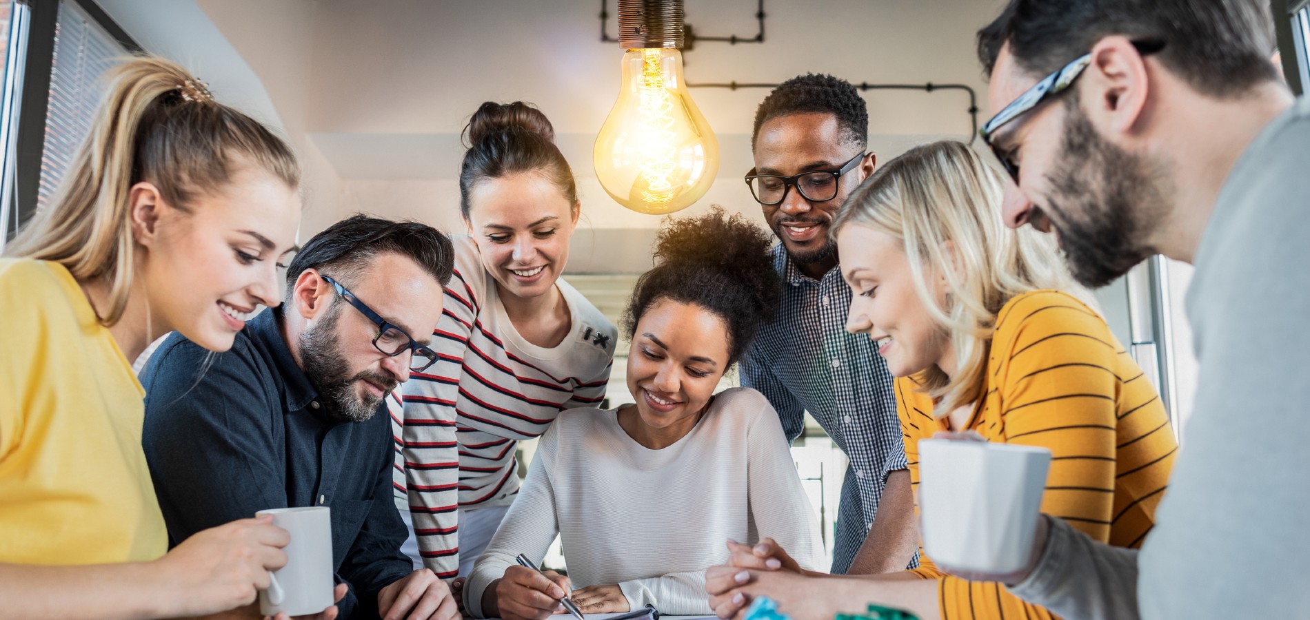 group of people looking at paperwork